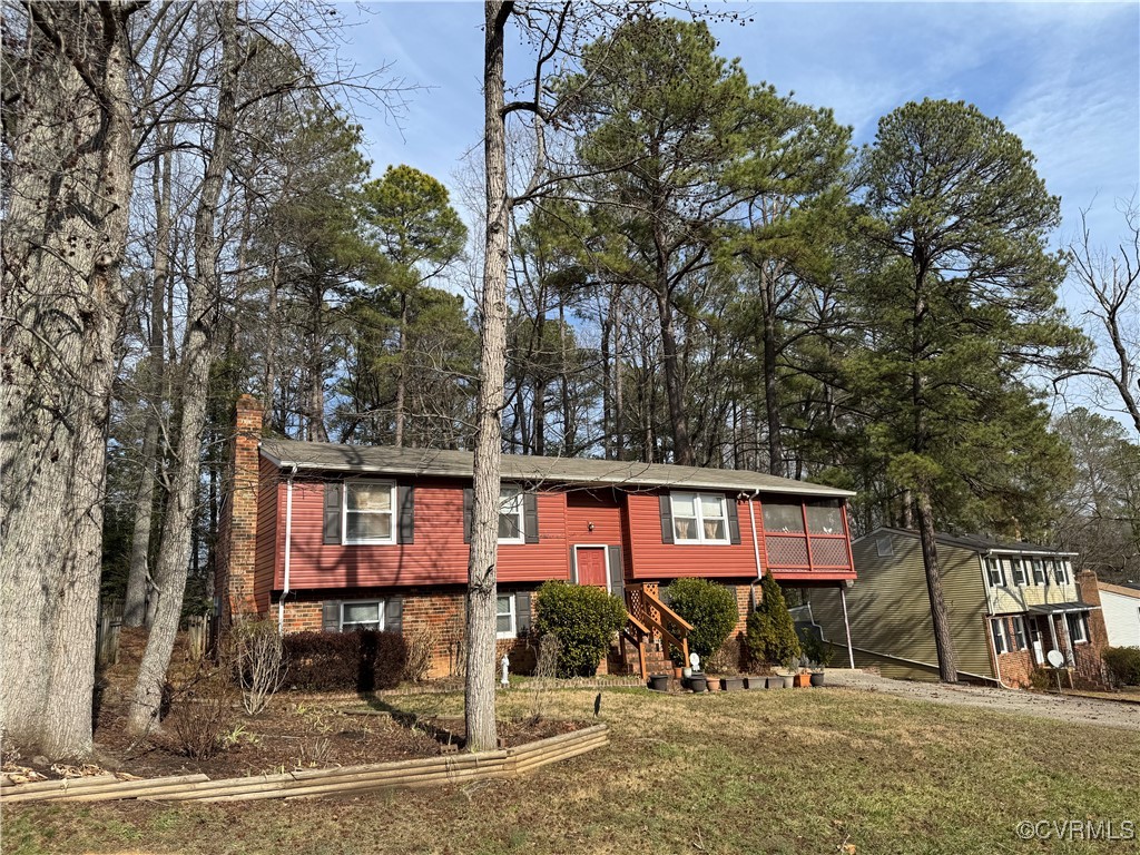 9332 Becar Road Chesterfield, VA 23236 - Photo 3 of 25 a front view of a building with trees