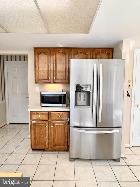 6825 Spring Beauty Court Springfield, VA 22152 - Photo 12 of 51 a kitchen with stainless steel appliances granite countertop a refrigerator a stove and a sink with granite countertops