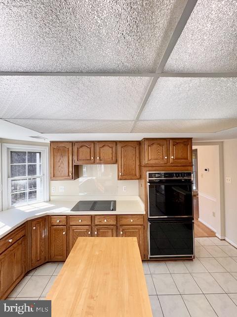 6825 Spring Beauty Court Springfield, VA 22152 - Photo 13 of 51 a kitchen with stainless steel appliances granite countertop a stove and a refrigerator