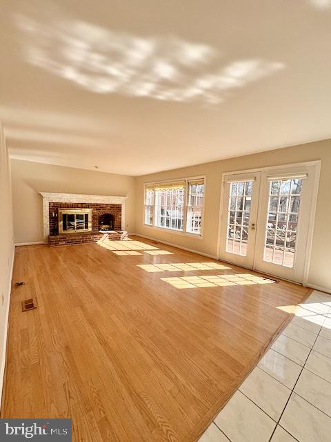 6825 Spring Beauty Court Springfield, VA 22152 - Photo 15 of 51 a view of empty room with floor to ceiling window and wooden floor