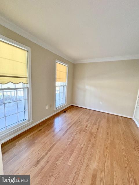 6825 Spring Beauty Court Springfield, VA 22152 - Photo 17 of 51 an empty room with wooden floor and windows