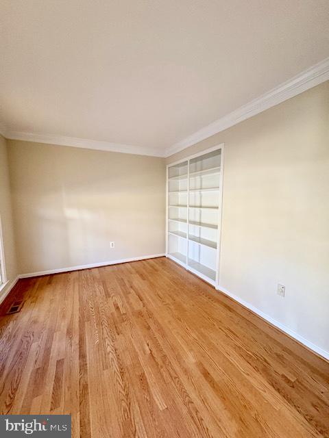 6825 Spring Beauty Court Springfield, VA 22152 - Photo 18 of 51 an empty room with wooden floor and windows