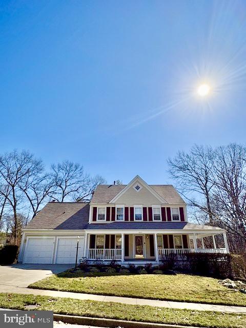 6825 Spring Beauty Court Springfield, VA 22152 - Photo 2 of 51 a front view of a house with a yard