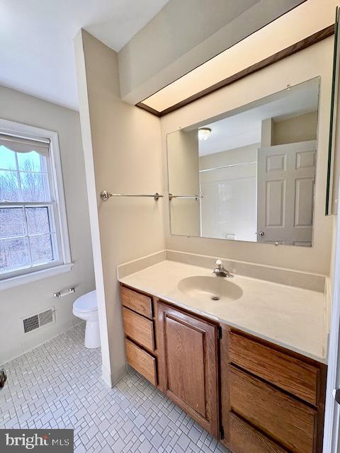 6825 Spring Beauty Court Springfield, VA 22152 - Photo 42 of 51 a bathroom with a granite countertop sink toilet and a mirror