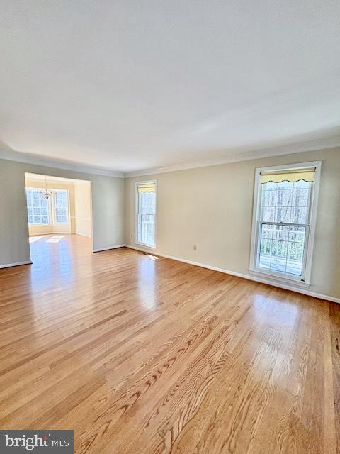 6825 Spring Beauty Court Springfield, VA 22152 - Photo 8 of 51 an empty room with wooden floor and windows