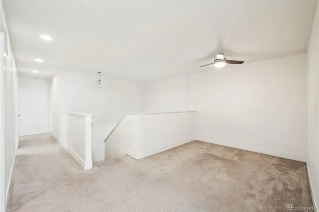 a bathroom with a granite countertop sink a toilet and bathtub