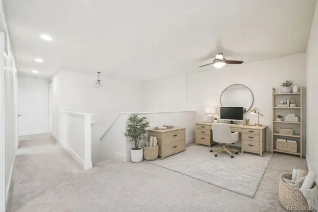 a kitchen with a sink a microwave a refrigerator and cabinets