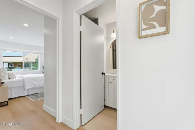 a view of an bathroom with tub and mirror
