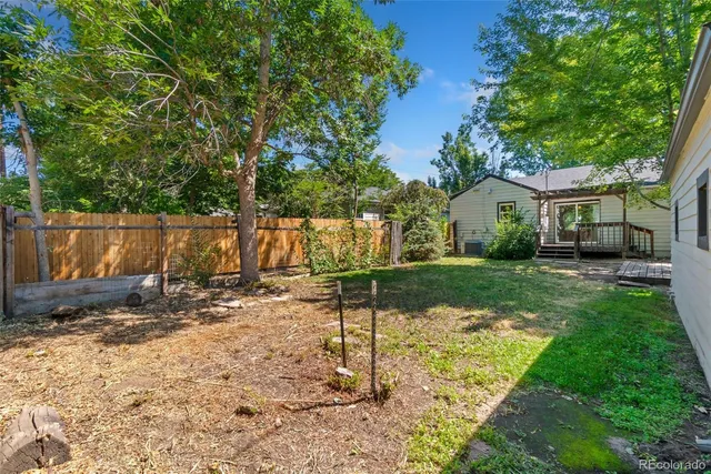 a backyard of a house with barbeque oven