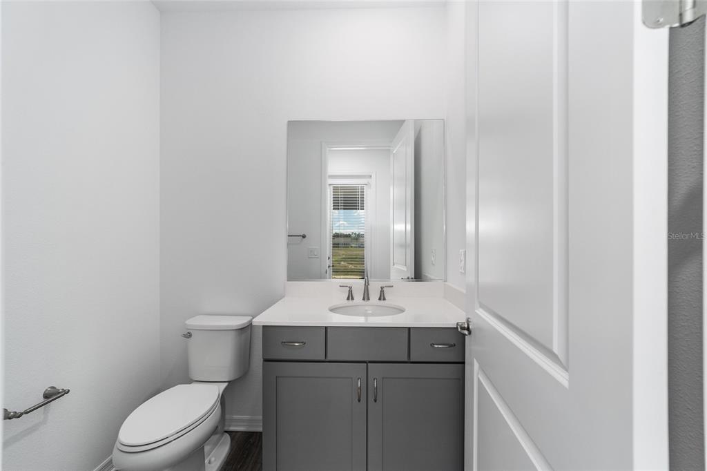 7232 Southwest 63rd Street Ocala, FL 34474 - Photo 15 of 54 a bathroom with a sink toilet and mirror