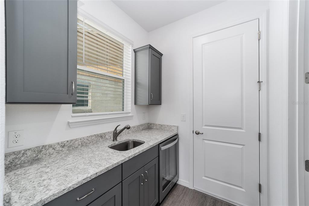 7232 Southwest 63rd Street Ocala, FL 34474 - Photo 25 of 54 a kitchen with a sink and cabinets