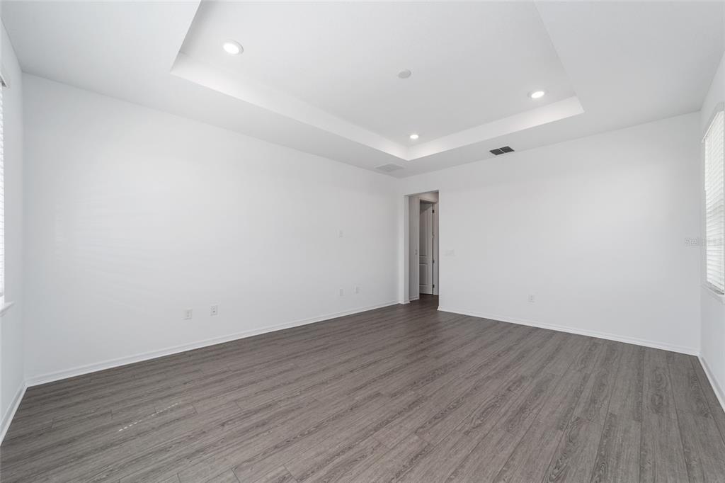 7232 Southwest 63rd Street Ocala, FL 34474 - Photo 34 of 54 a view of an empty room with wooden floor