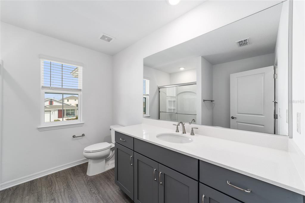 7232 Southwest 63rd Street Ocala, FL 34474 - Photo 40 of 54 a bathroom with a sink double vanity and a toilet