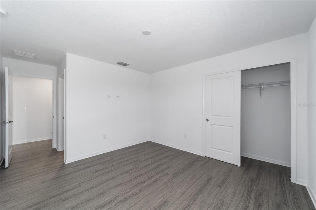 7232 Southwest 63rd Street Ocala, FL 34474 - Photo 43 of 54 a view of an empty room with wooden floor