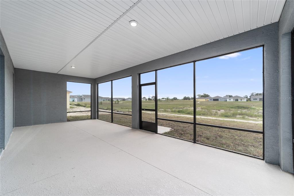 7232 Southwest 63rd Street Ocala, FL 34474 - Photo 50 of 54 a view of an empty room with windows and city view