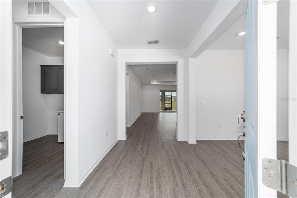 7232 Southwest 63rd Street Ocala, FL 34474 - Photo 6 of 54 a view of a hallway with wooden floor