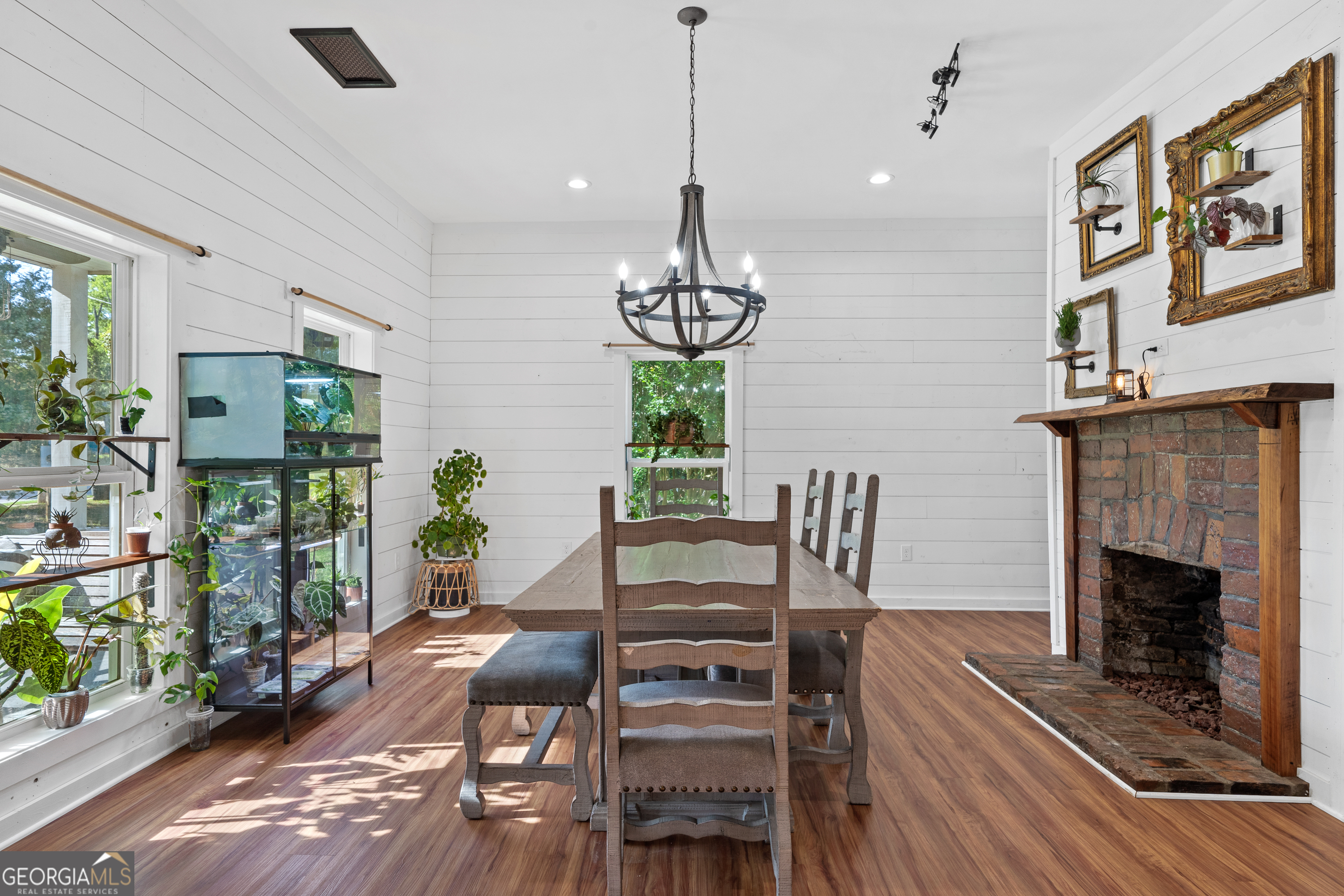 7170 Church Street Bartow, GA 30413 - Photo 12 of 49 a view of a dining room with furniture wooden floor and chandelier