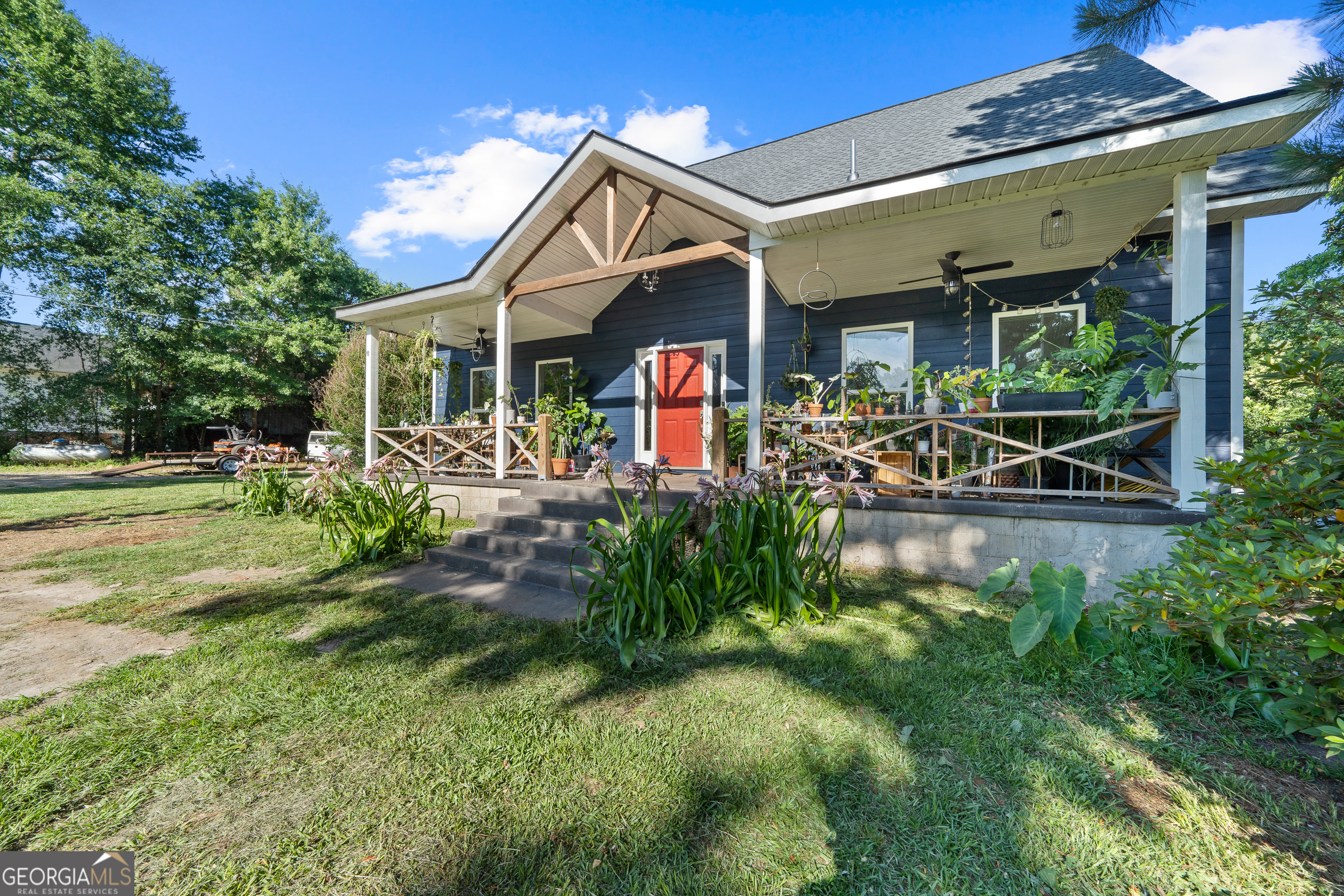 7170 Church Street Bartow, GA 30413 - Photo 2 of 49 a view of a house with a swimming pool