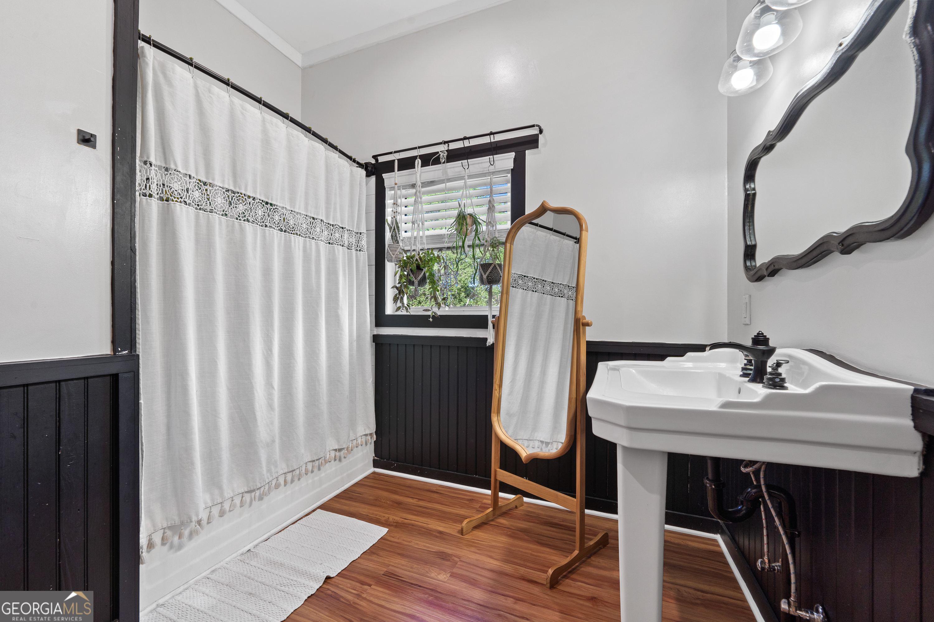 7170 Church Street Bartow, GA 30413 - Photo 28 of 49 a bathroom with a sink and a mirror