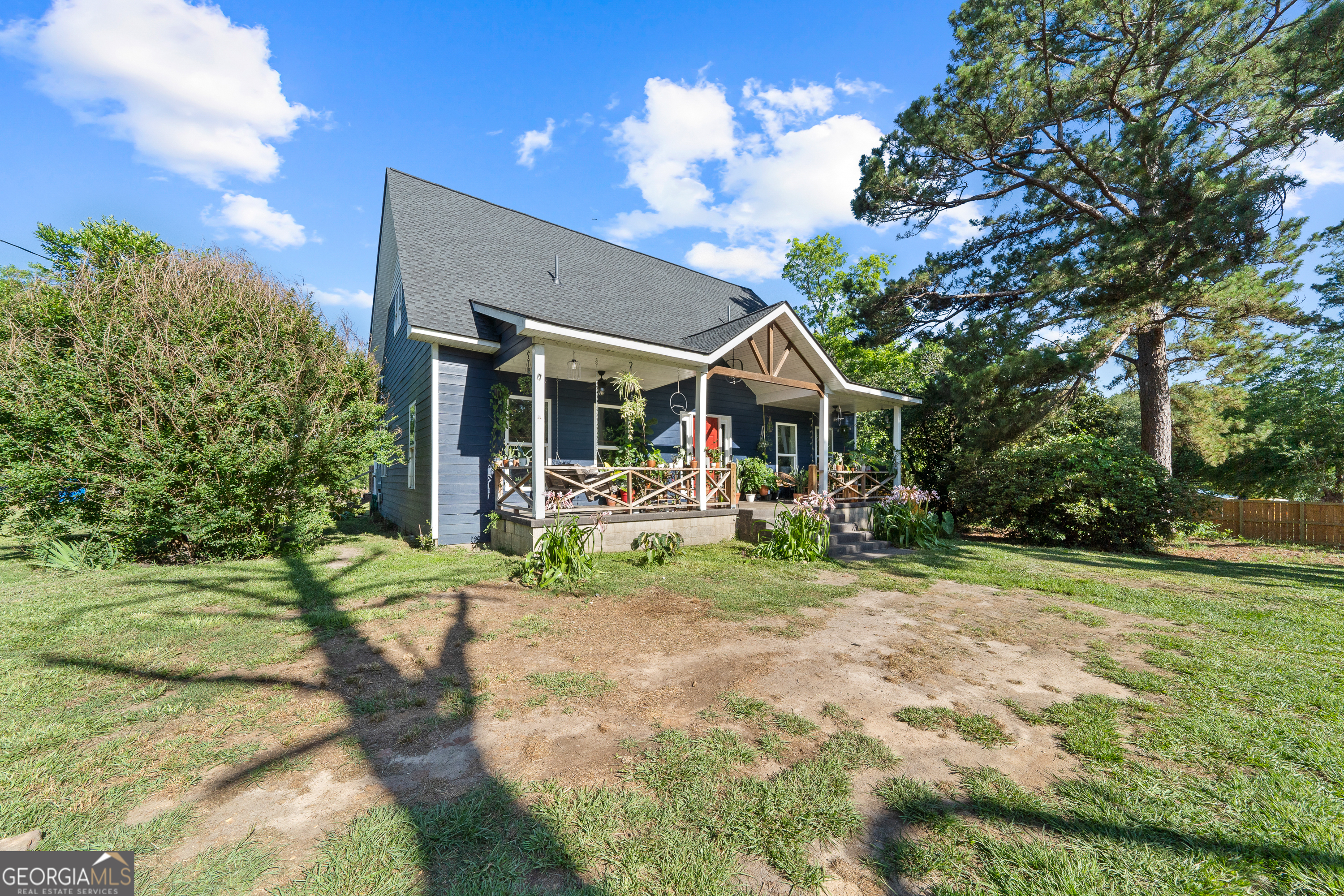 7170 Church Street Bartow, GA 30413 - Photo 3 of 49 a view of a house with backyard and sitting area