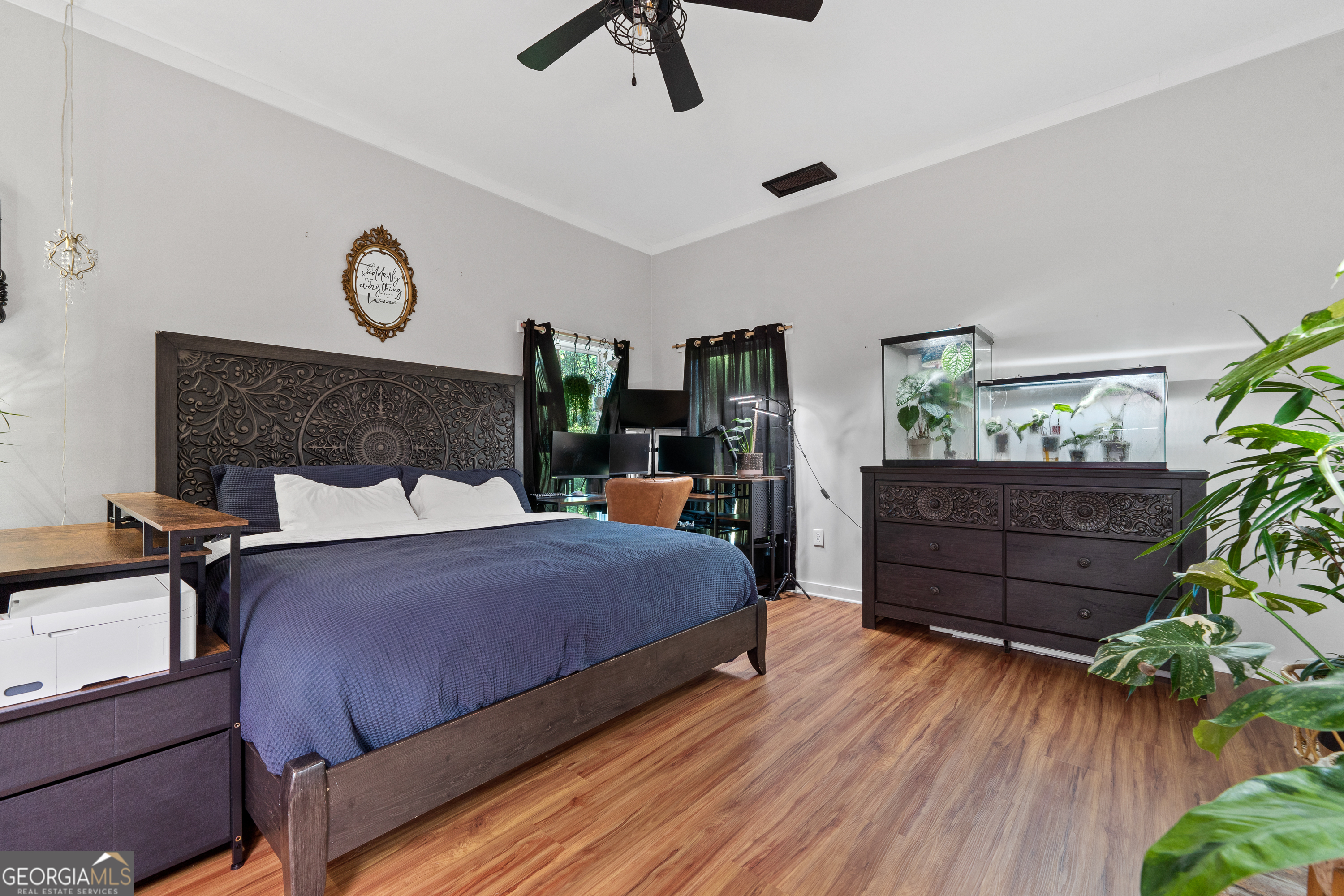 7170 Church Street Bartow, GA 30413 - Photo 31 of 49 a bedroom with a bed and wooden floor