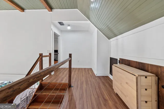 a view of wooden floor and staircase