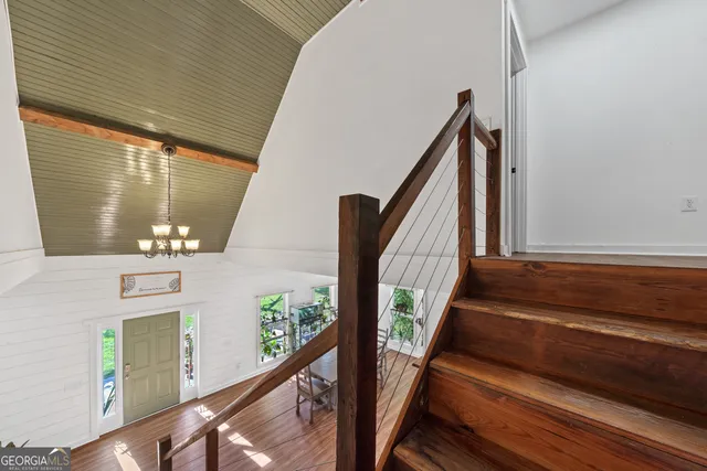 a view of balcony with wooden floor and stairs