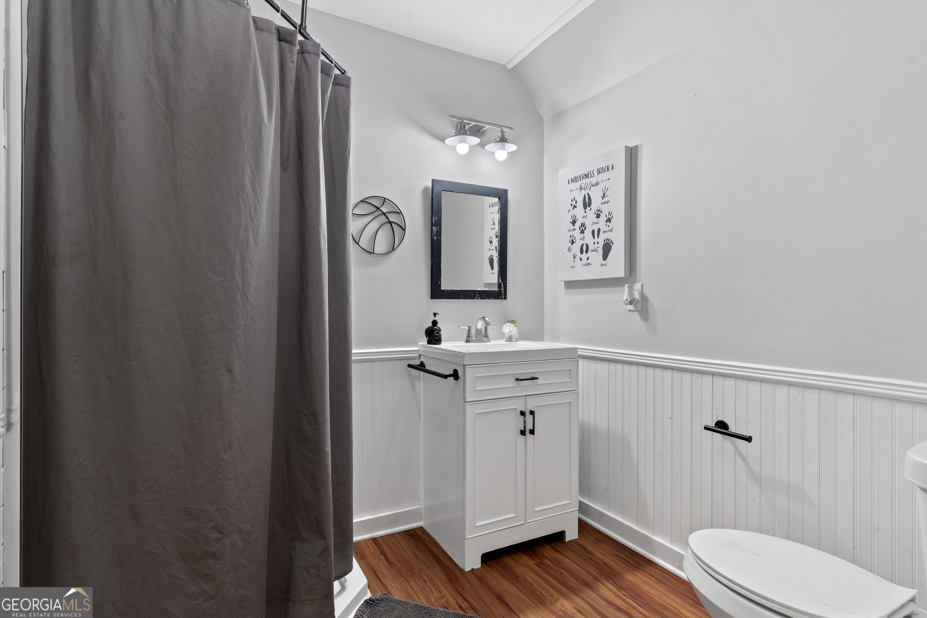 7170 Church Street Bartow, GA 30413 - Photo 44 of 49 a bathroom with a sink a toilet a mirror and shower