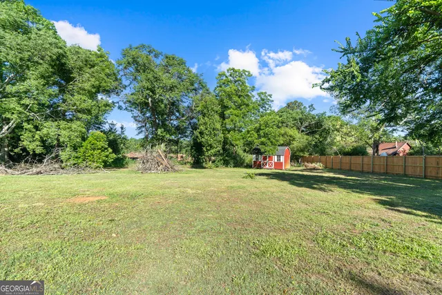 a backyard of a house with lots of green space