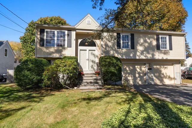 front view of a house with a yard