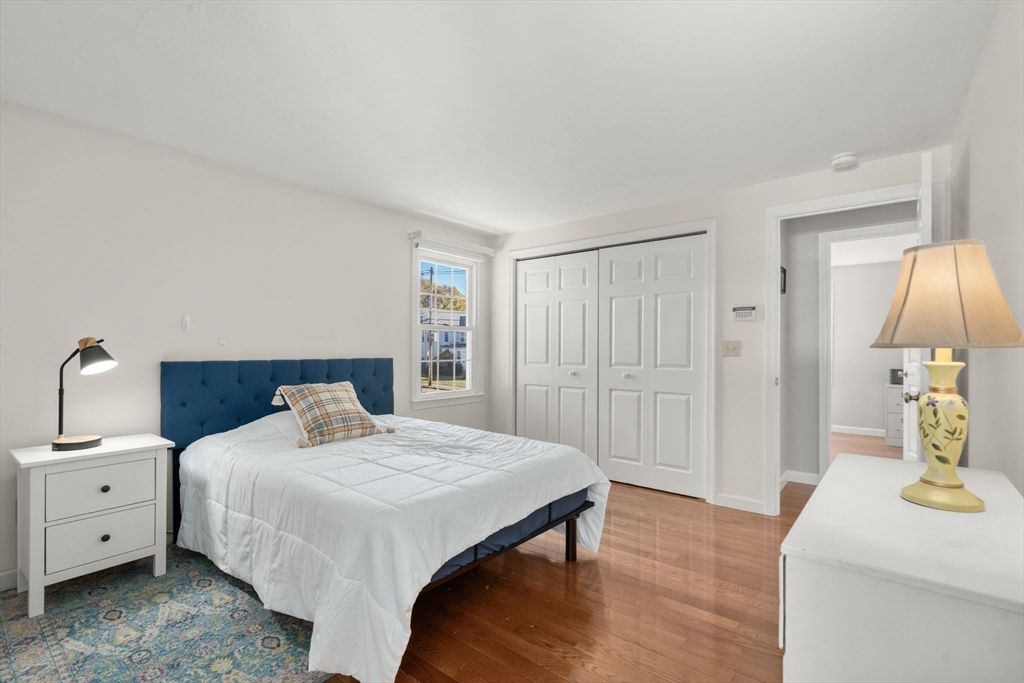 154 Danforth Street Framingham, MA 01701 - Photo 12 of 30 a bedroom with a bed and a table