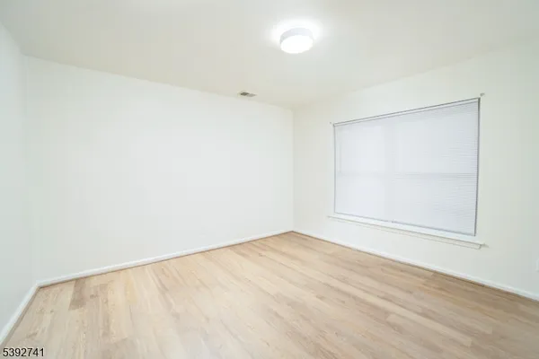 an empty room with a empty space and window