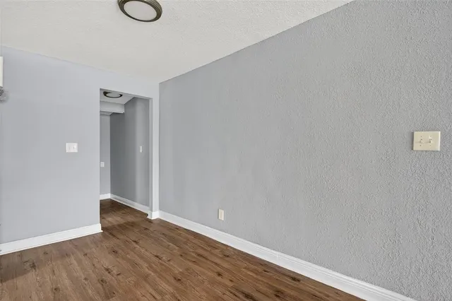 a white toilet sitting next to a bathroom sink and tub