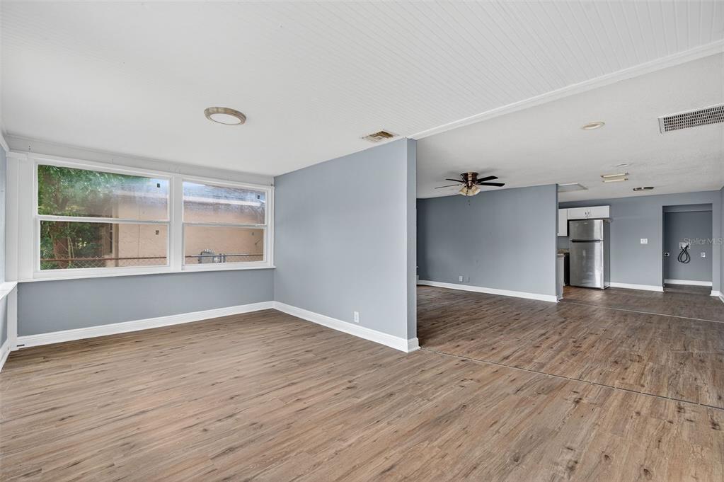 5801 Virginia Avenue New Port Richey, FL 34652 - Photo 20 of 81 a view of empty room with wooden floor and fan
