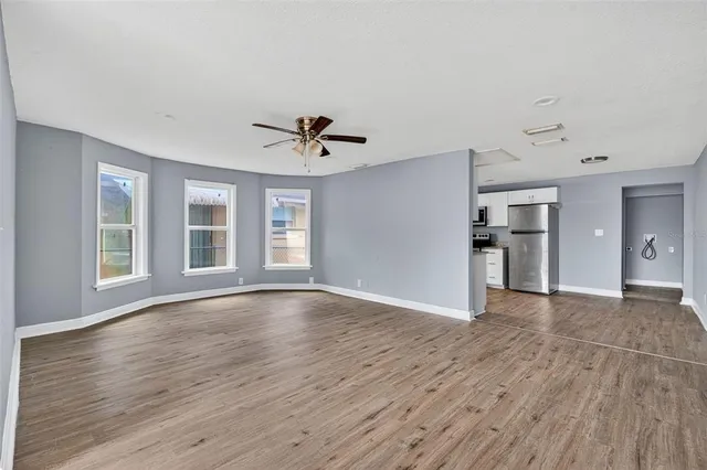 a front view of house with yard and trees