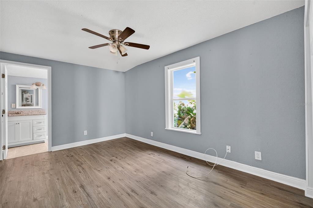 5801 Virginia Avenue New Port Richey, FL 34652 - Photo 32 of 81 wooden floor in an empty room with a window