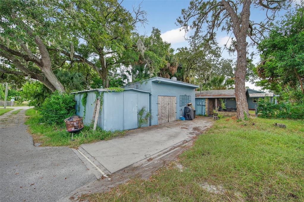 5801 Virginia Avenue New Port Richey, FL 34652 - Photo 38 of 81 a front view of house with yard and trees