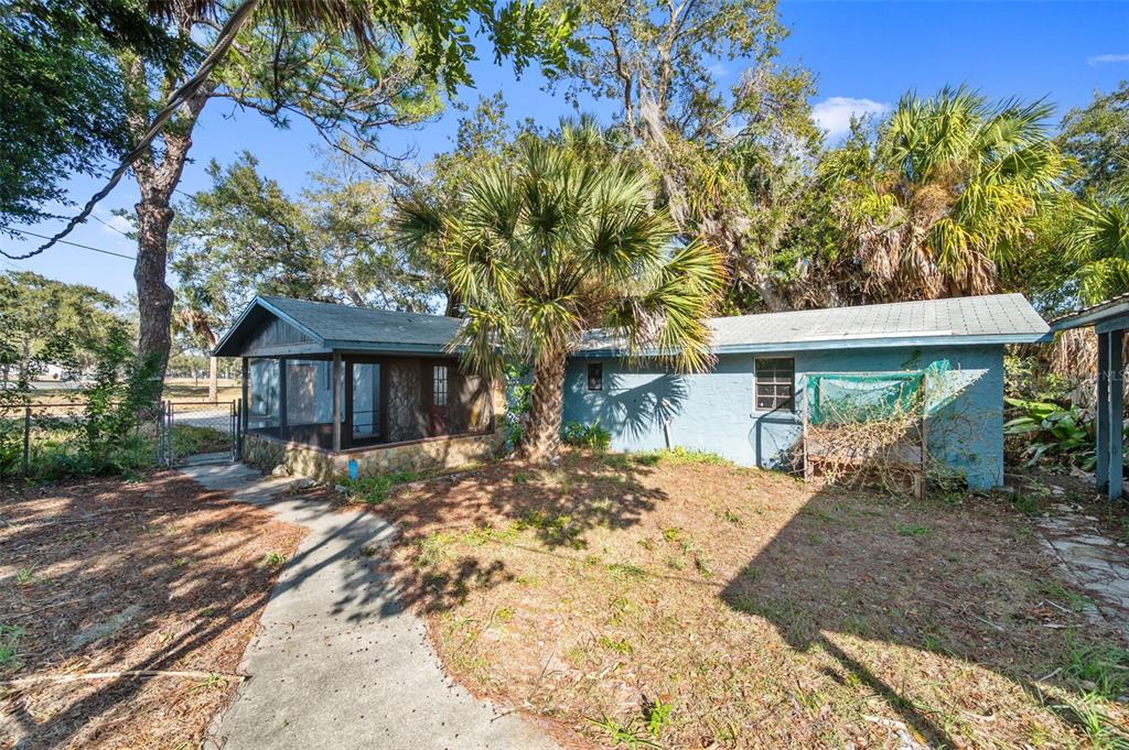 5801 Virginia Avenue New Port Richey, FL 34652 - Photo 45 of 81 a view of a house with a tree in front of it