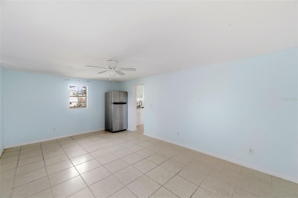 5801 Virginia Avenue New Port Richey, FL 34652 - Photo 52 of 81 an empty room with a windows and ceiling fan