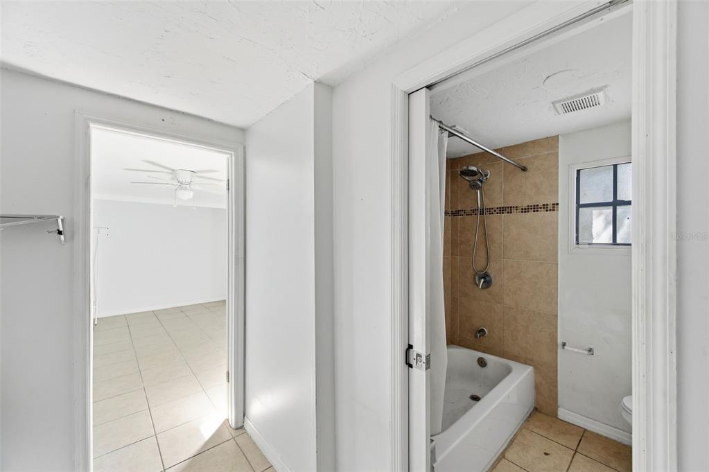 5801 Virginia Avenue New Port Richey, FL 34652 - Photo 58 of 81 a bathroom with a bathtub and shower