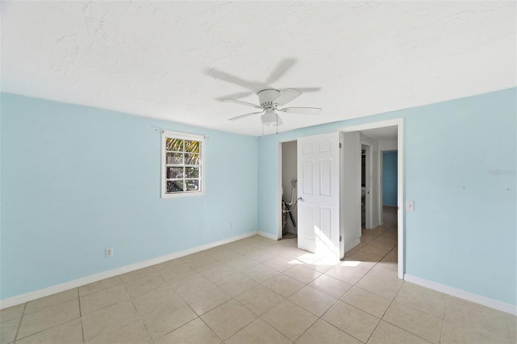 5801 Virginia Avenue New Port Richey, FL 34652 - Photo 65 of 81 a view of an empty room with a ceiling fan