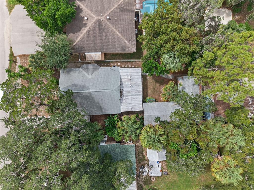 5801 Virginia Avenue New Port Richey, FL 34652 - Photo 74 of 81 an aerial view of a house with yard and trees all around