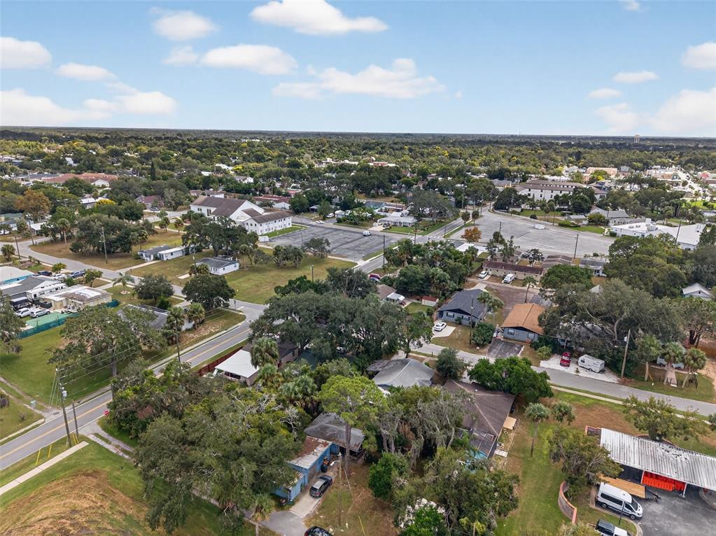 5801 Virginia Avenue New Port Richey, FL 34652 - Photo 78 of 81 an aerial view of residential houses with outdoor space and trees
