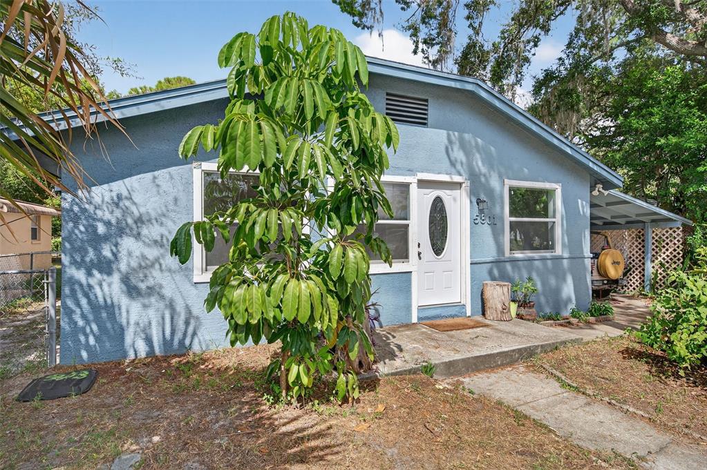 5801 Virginia Avenue New Port Richey, FL 34652 - Photo 8 of 81 a front view of a house with garden