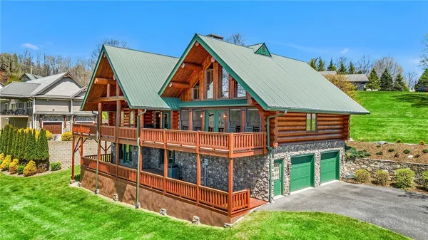 an aerial view of a house with swimming pool