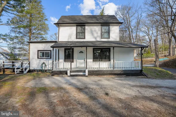 a front view of a house with a garage