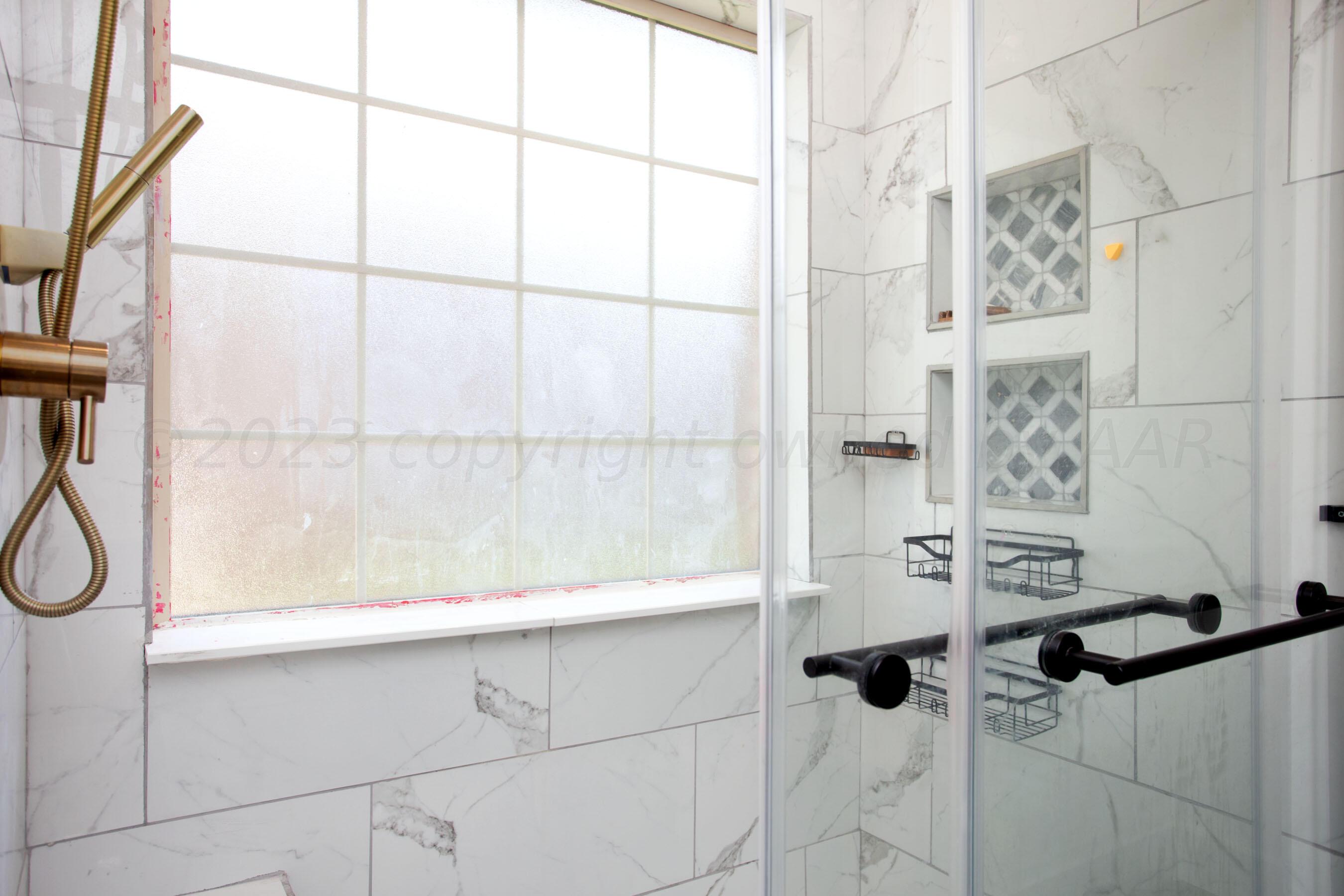 4511 South Roberts Street Amarillo, TX 79118 - Photo 13 of 26 a bathroom with a shower