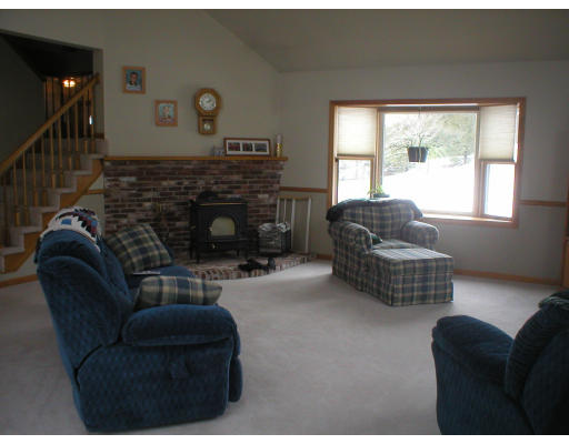 94 Houghton's Mill Road Lunenburg, MA 01462 - Photo 3 of 14 a living room with furniture and a fireplace
