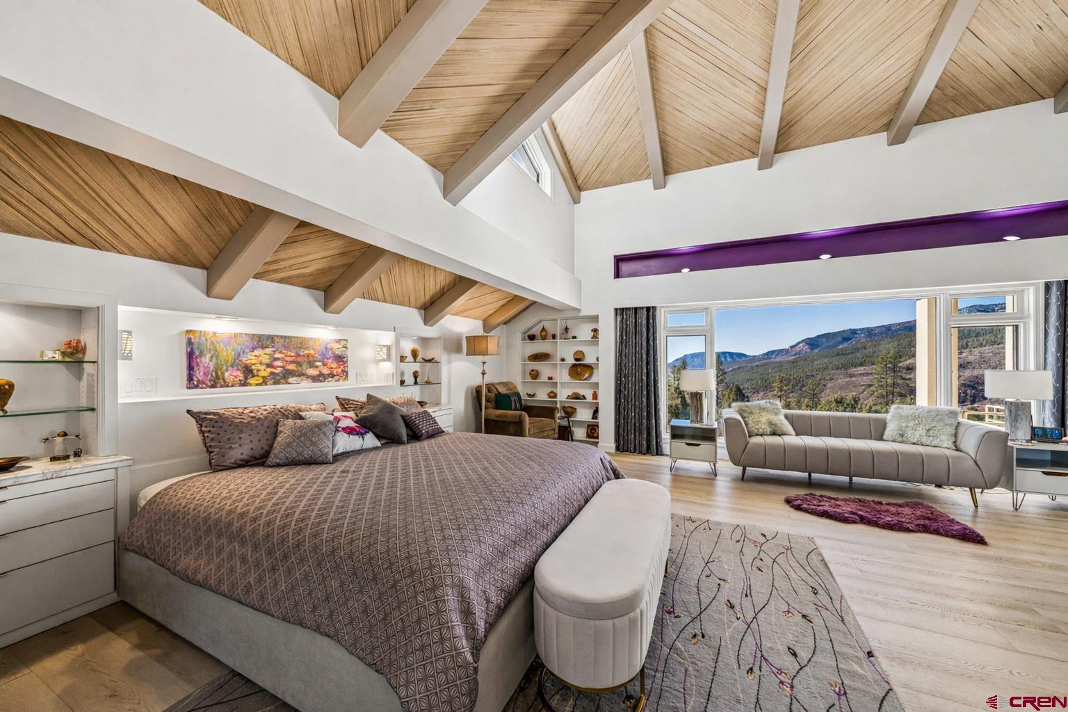 247 Rimrock Drive Durango, CO 81301 - Photo 21 of 45 a bedroom with a large bed and a large window with outer view