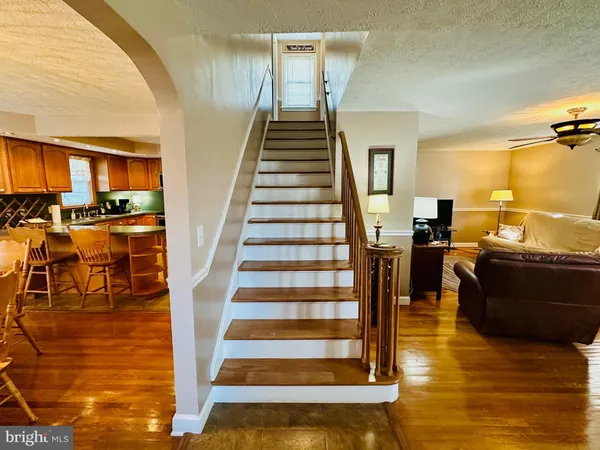 a view of a living room and dining room with furniture